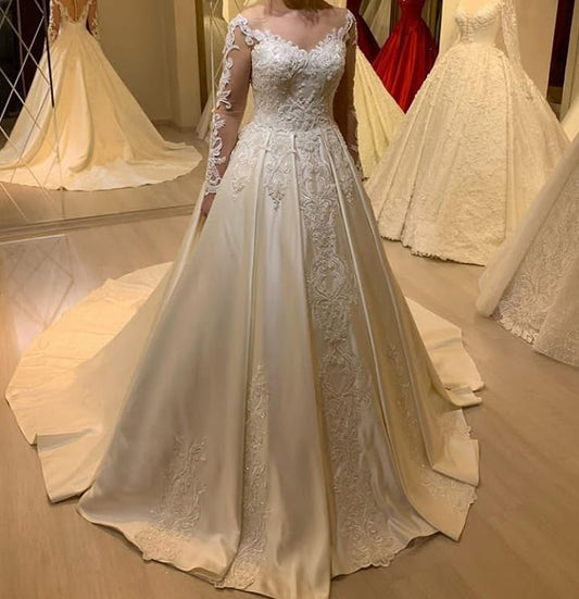 Elegant Sweetheart Pearl Satin A-Line Wedding Gown with Lace Appliques and Long Sleeves