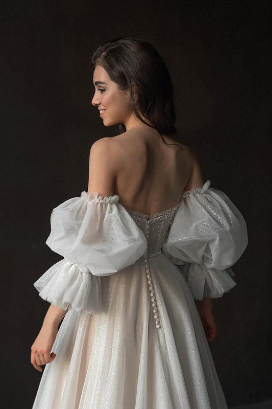 Elegant White Tulle Strapless Gown with Puff Sleeves, Long Split, and Beadings
