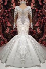 Elegant Sweetheart Mermaid Wedding Dress with Long Sleeves, Lace Appliques, and Beadings Ballbellas