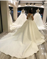 Elegant Sweetheart Princess Wedding Gown with Long Satin Sleeves and Appliques
