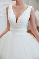 Elegant A-Line Wedding Gown with Deep V-Neck and Wide Tulle Straps