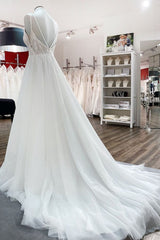 Elegant A-line Wedding Dress with V-neck, Sequins, Tulle Ruffles, and Backless Design