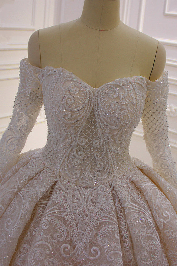 Elegant Off-The-Shoulder Ball Gown Wedding Dress with Lace Appliques and Long Sleeves
