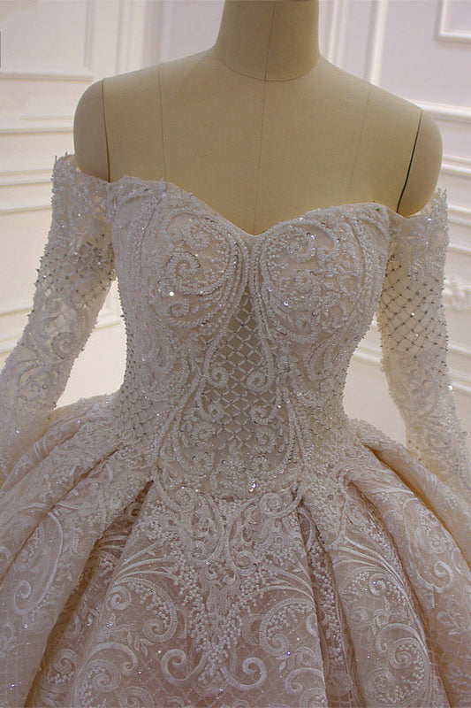 Elegant Off-The-Shoulder Ball Gown Wedding Dress with Lace Appliques and Long Sleeves