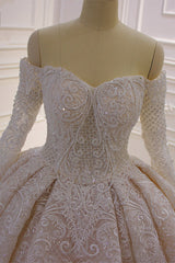 Elegant Off-The-Shoulder Ball Gown Wedding Dress with Lace Appliques and Long Sleeves