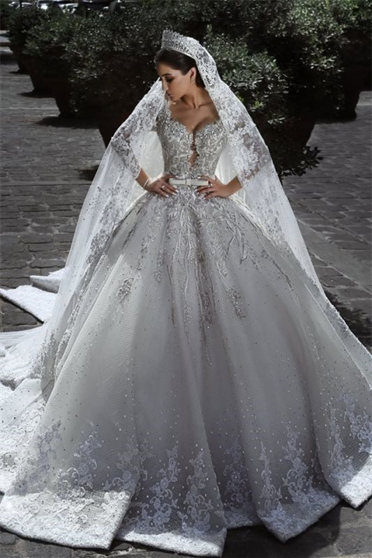 Wedding Dress with Long Sleeves, Beads, and Lace Appliques in a Ball Gown Style