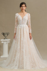 Elegant Long-Sleeve Illusion Wedding Gown in Sheer Tulle with Lace