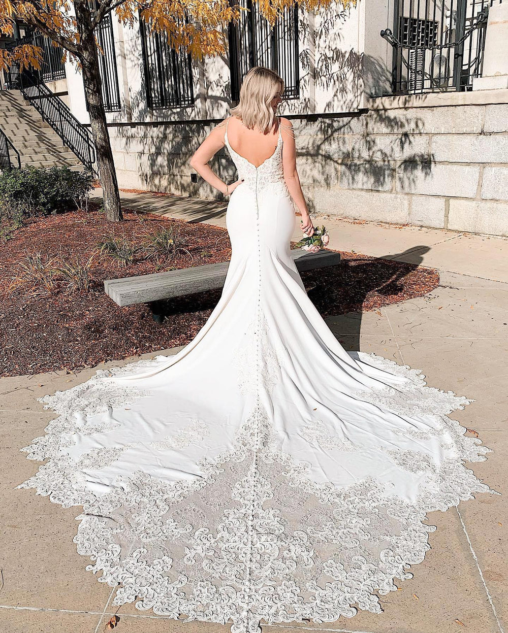 Elegant V-neck Backless Spaghetti Strap Mermaid Bridal Gown Featuring Lace Appliques