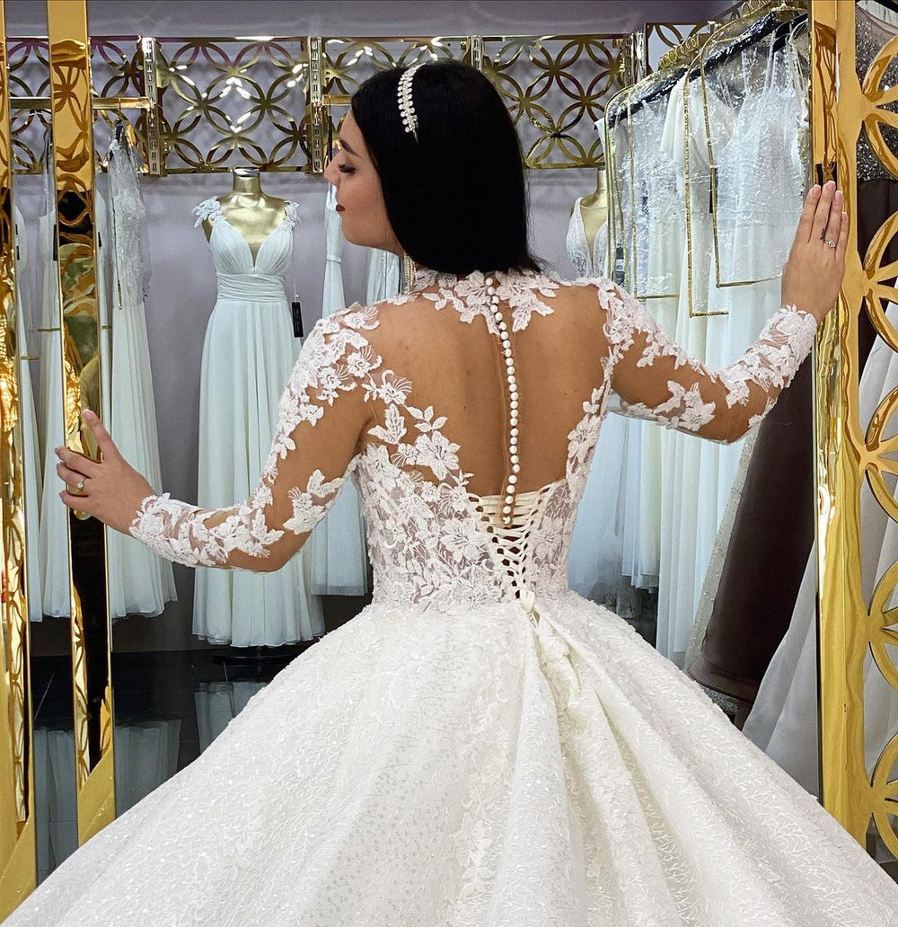 Elegant High-neck Long Sleeve Wedding Dress Featuring Lace Appliques