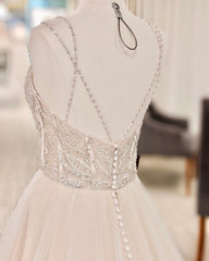 Elegant V-neck A-line Wedding Gown with Backless Design and Pearl Details