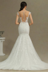 Elegant Sheer Mermaid Bridal Gown with Cap Sleeves and Tulle Appliques