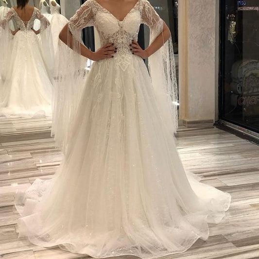 Elegant Short-Sleeve Backless A-Line Wedding Gown with Deep V-Neck, Lace Appliques, and Pearls