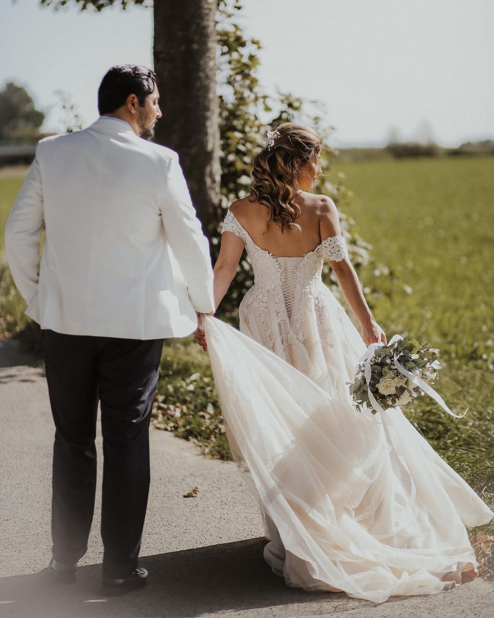 Elegant Off-The-Shoulder Boho Wedding Gown in A-line Tulle and Lace