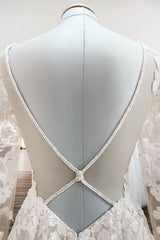 Elegant Ivory A-line Wedding Dress with Long Lace Sleeves and Open Back Tulle Details