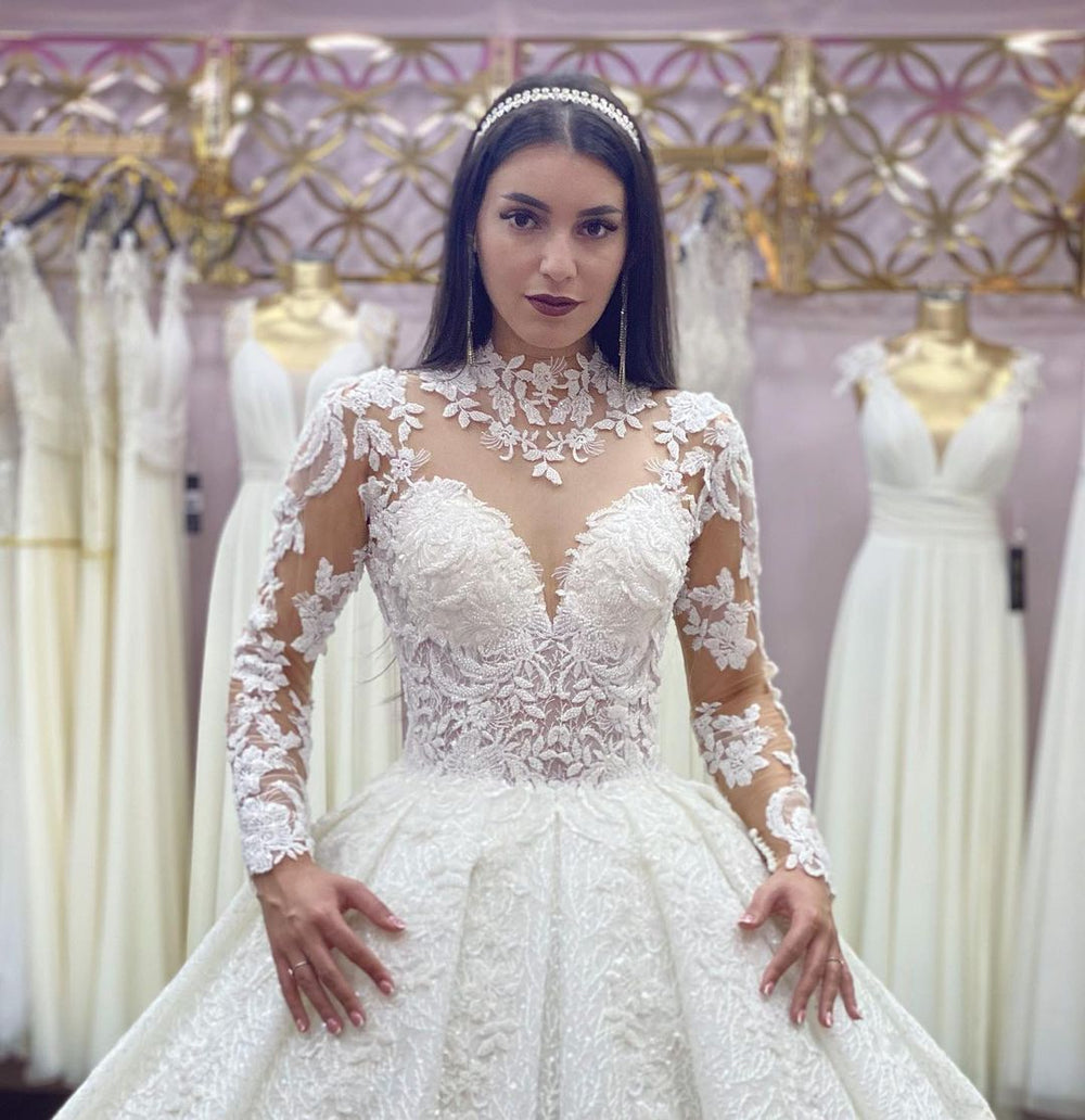 Elegant High-neck Long Sleeve Wedding Dress Featuring Lace Appliques