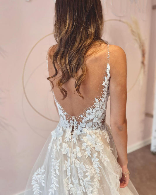 A-Line Floor-Length Wedding Dress with Appliques Lace, Deep V-Neck and Backless Tulle Design