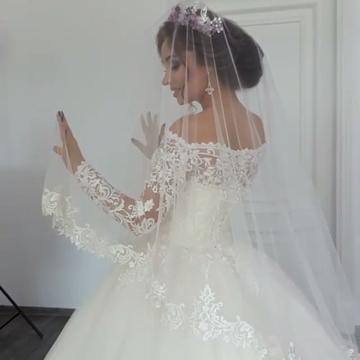 Elegant Off-the-Shoulder Ball Gown with Long Sleeves and Lace Appliques