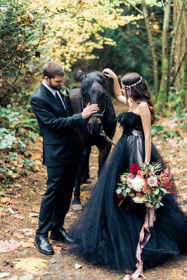 Elegant strapless black A-line wedding gown with lace appliques and tulle