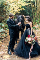 Elegant strapless black A-line wedding gown with lace appliques and tulle