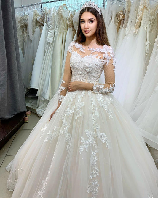 Elegant Floor-length Princess Wedding Dress in Bateau Style with Long Sleeves and Lace Appliques