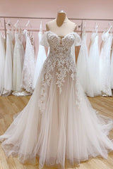 Elegant A-Line Off-the-Shoulder Wedding Gown Featuring a Backless Sweetheart Tulle Train