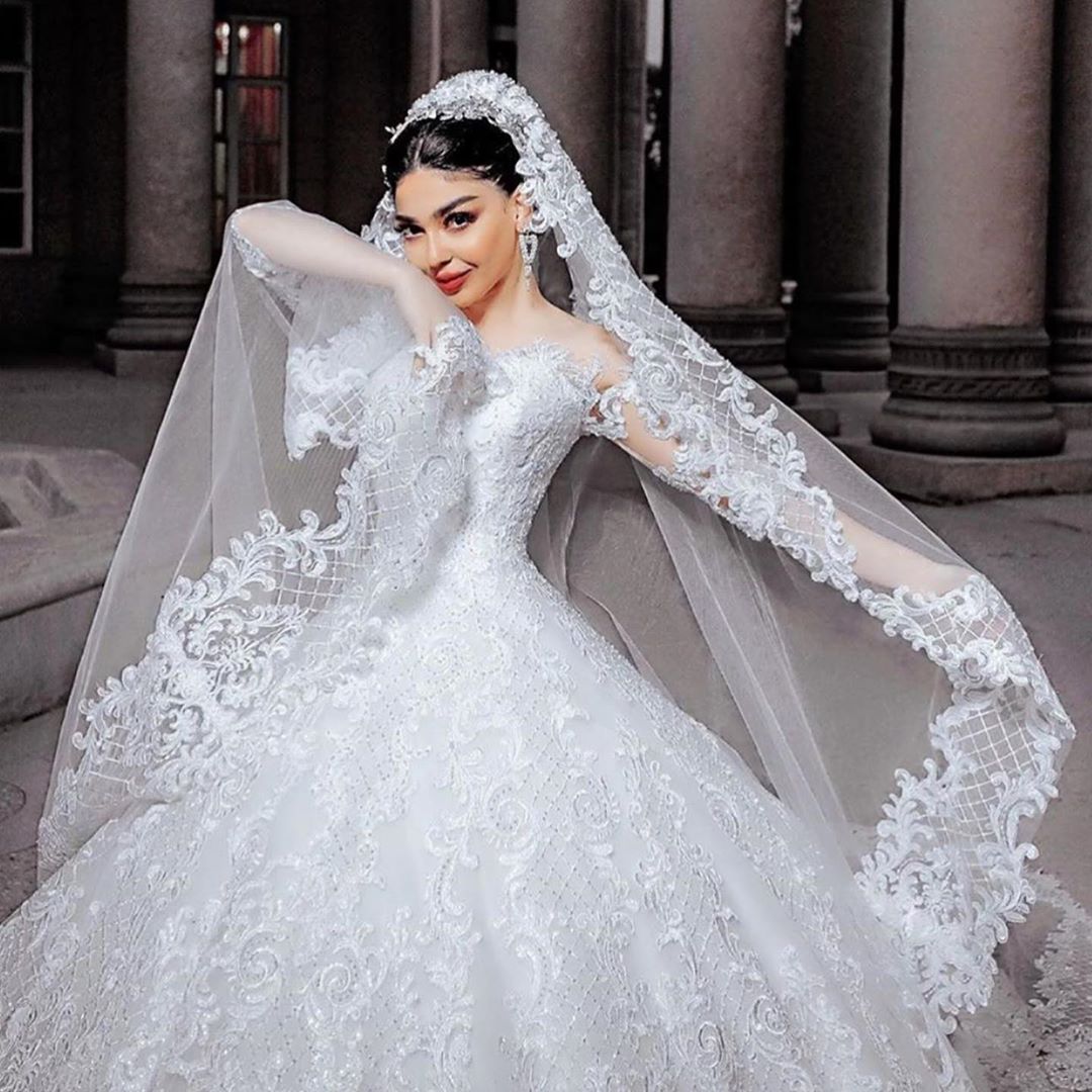 Elegant Princess Wedding Gown with Chic Bead Appliques and Long Sleeves in Tulle