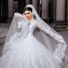 Elegant Princess Wedding Gown with Chic Bead Appliques and Long Sleeves in Tulle