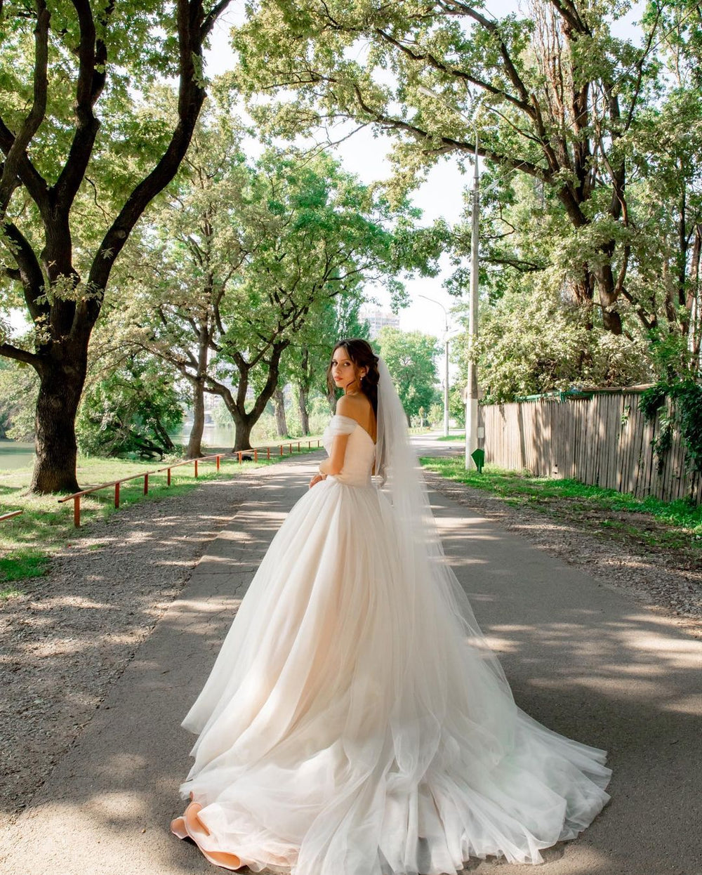 Elegant A-line Long Tulle Wedding Gown with Off-the-shoulder Neckline and Chapel Train