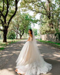 Elegant A-line Long Tulle Wedding Gown with Off-the-shoulder Neckline and Chapel Train