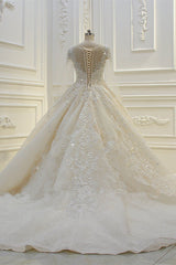 Elegant Beaded Bateau Ball Gown Wedding Dress with Lace Appliques and Long Sleeves