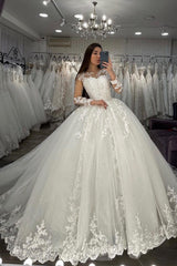 Elegant Long-Sleeve Sheer Tulle Ball Gown Wedding Dress Featuring Appliques