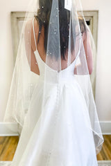 Sweetheart A-Line Wedding Dress with Elegant Spaghetti Straps and Satin Backless Design