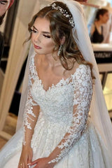 Elegant white lace wedding dress featuring a V-neck and long sleeves in an A-line silhouette