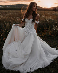 Elegant Off-The-Shoulder A-line Wedding Gown in Tulle with Lace Appliques