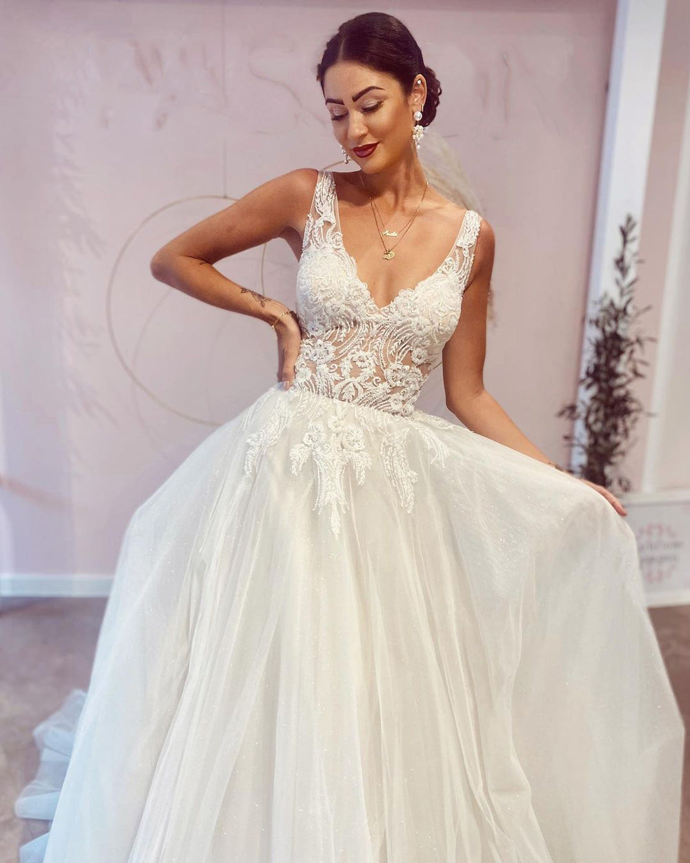Elegant Backless A-Line Wedding Dress with Deep V-Neck and Lace Appliques