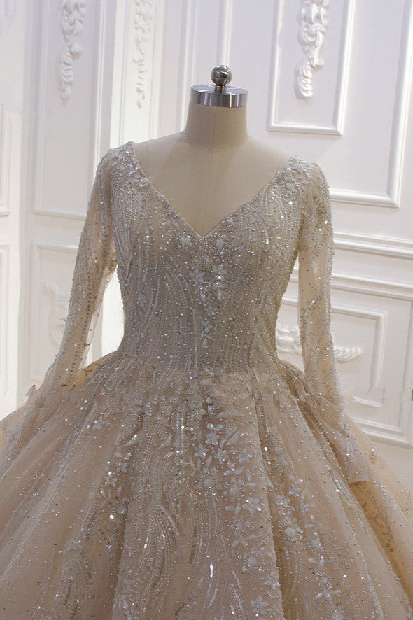 Elegant V-neck Ball Gown with Long Sleeves, Sequins, Beading, and Ruffles
