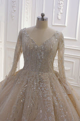 Elegant V-neck Ball Gown with Long Sleeves, Sequins, Beading, and Ruffles