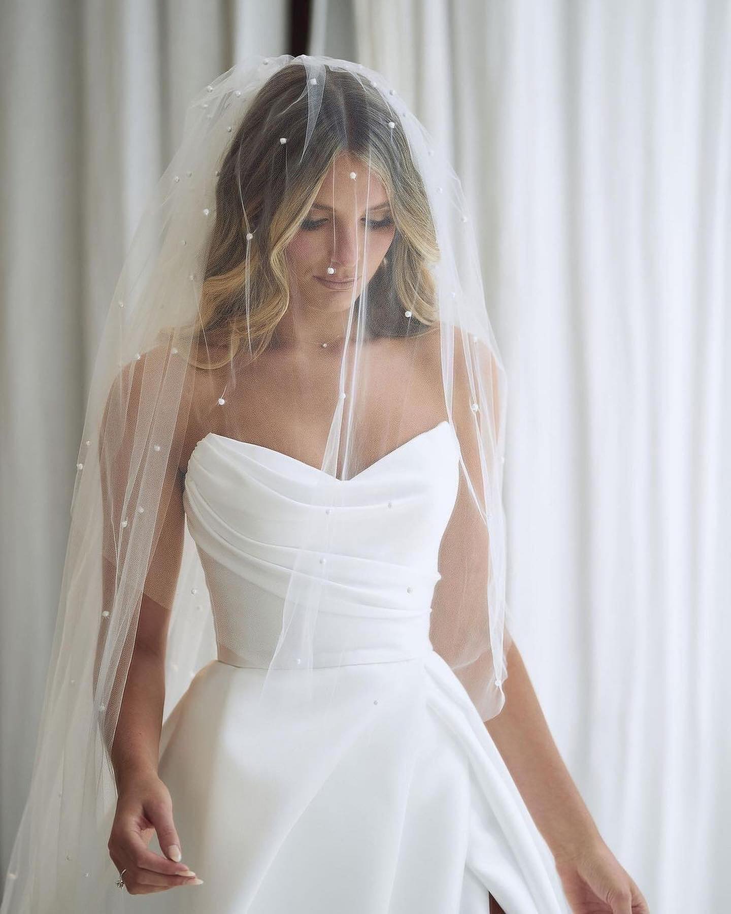 Elegant Sweetheart A-Line Satin Wedding Dress with Floor-length Ruffled Slit