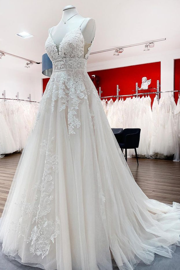 V-neck sleeveless A-line tulle wedding dress with backless design, lace appliques, and ruffles