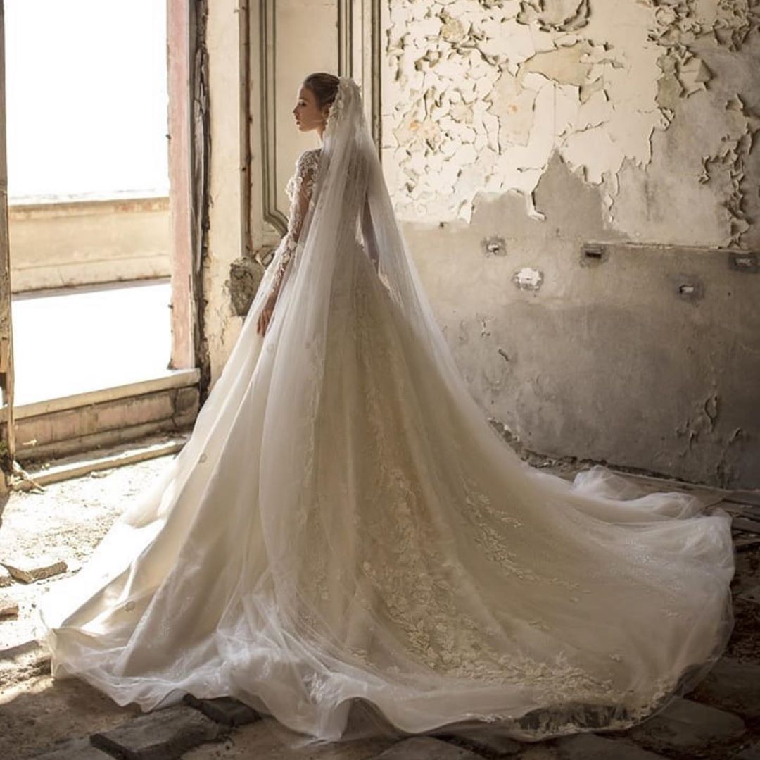 Elegant Deep V-neck A-Line Wedding Gown with Long Sleeves and Tulle Lace Ruffles