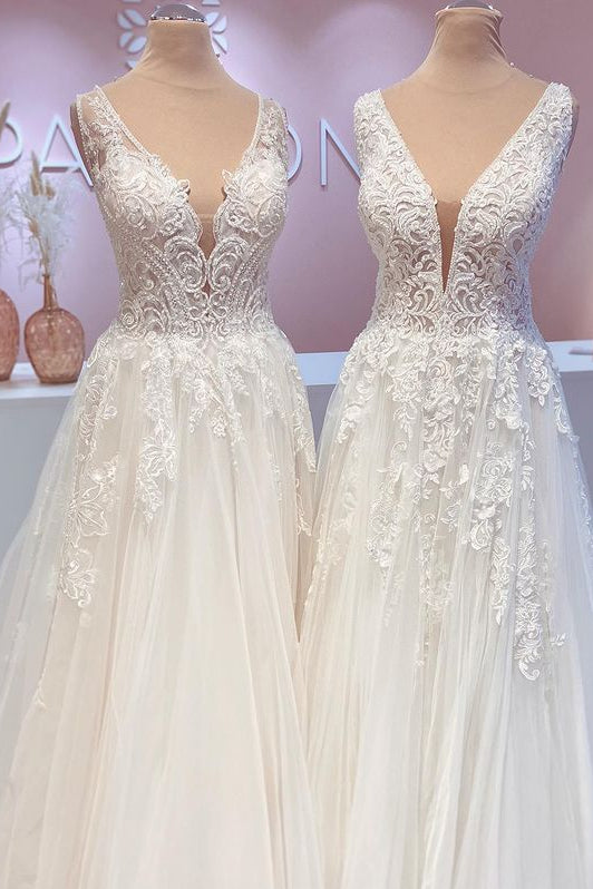 Contemporary A-Line Wedding Gown with Open Back, Lace Train, and Wide Straps Featuring Tulle Appliques