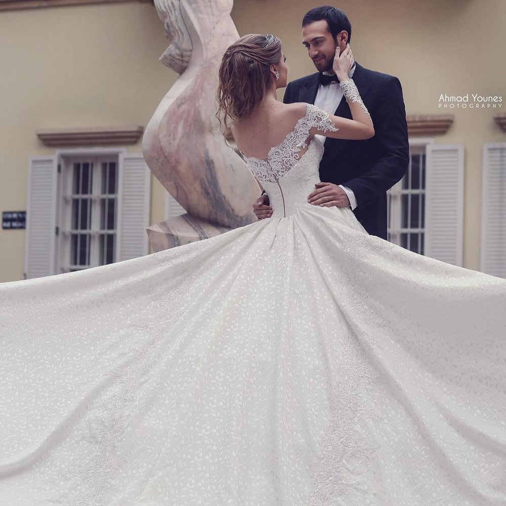 Elegant Off-the-Shoulder A-Line Wedding Gown with Lace Backless Detail and Long Sleeves