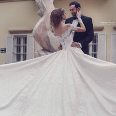 Elegant Off-the-Shoulder A-Line Wedding Gown with Lace Backless Detail and Long Sleeves