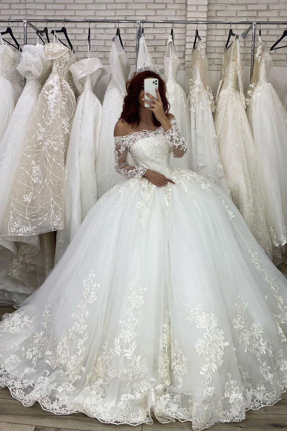 Elegant Off-The-Shoulder Illusion Ball Gown Wedding Dress with Long Sleeves and Appliques