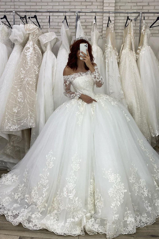 Elegant Off-The-Shoulder Illusion Ball Gown Wedding Dress with Long Sleeves and Appliques