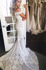 Elegant Mermaid Wedding Dress with Off-Shoulder Neckline and Sweep Train Appliques