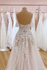 Elegant A-Line Off-the-Shoulder Wedding Gown Featuring a Backless Sweetheart Tulle Train