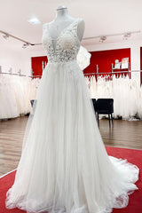Elegant Backless Long A-line Wedding Dress with V-neck, Tulle Ruffles, and Lace