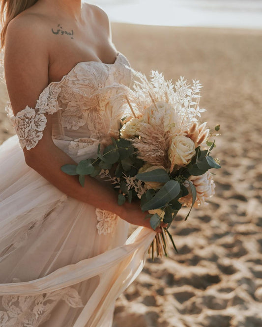 Elegant Off-the-Shoulder A-Line Wedding Gown with Lace Appliques and Tulle