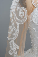 Elegant Long Sleeve Ruffled Ball Gown Wedding Dress Featuring Lace Appliques